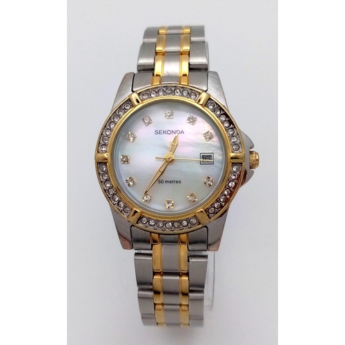 1104 - A Ladies Unworn, Stone Set Bezel & Face, Bi-Metal Sekonda Quartz Date Watch.  32mm Including Crown. ... 