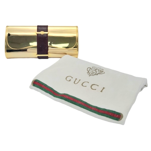 165 - A Fabulous Gucci Gold Tone Metal and Lizard Trim Clutch Bag. Soft textile interior with mirror. In g... 