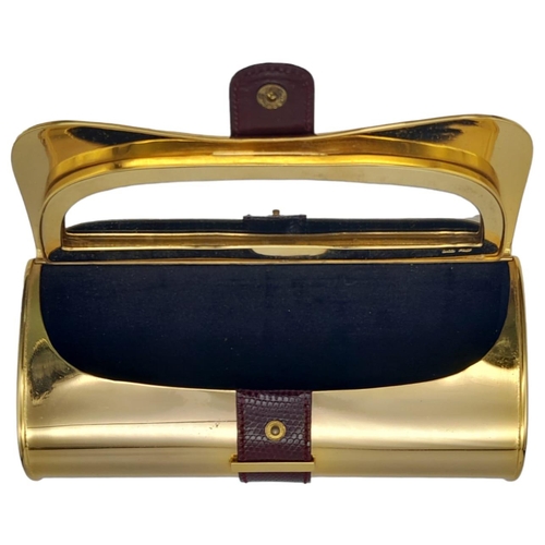 165 - A Fabulous Gucci Gold Tone Metal and Lizard Trim Clutch Bag. Soft textile interior with mirror. In g... 