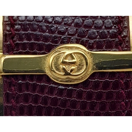 165 - A Fabulous Gucci Gold Tone Metal and Lizard Trim Clutch Bag. Soft textile interior with mirror. In g... 