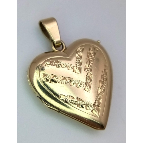 398 - A 14K yellow gold heart locket, 4.5g . 38mm x 20mm

ref: SH1303I-1