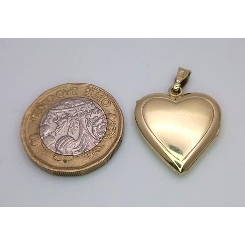 398 - A 14K yellow gold heart locket, 4.5g . 38mm x 20mm

ref: SH1303I-1