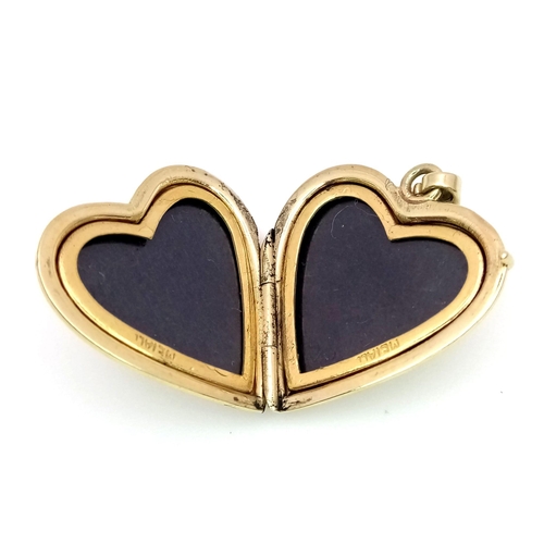 398 - A 14K yellow gold heart locket, 4.5g . 38mm x 20mm

ref: SH1303I-1