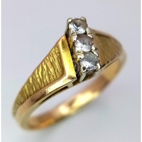 412 - A 18K yellow gold vintage style CZ trilogy ring, 3.9g, size N, (cz:3x 2mm)

ref: SH1257I