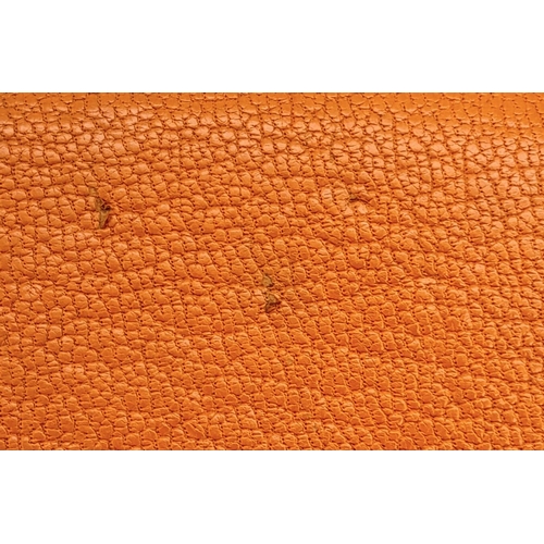 452 - A Hermes Burnt Orange Leather Wallet. Burnt orange leather interior with zipped and open compartment... 