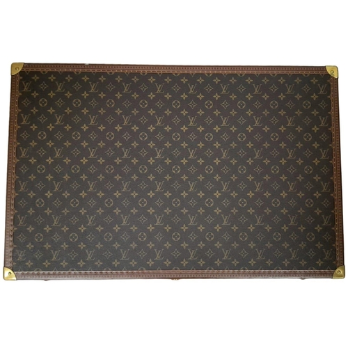 60 - A Louis Vuitton Alzer 80 Monogram Large Sturdy Suitcase/Trunk. Monogram canvas and brown leather ext... 