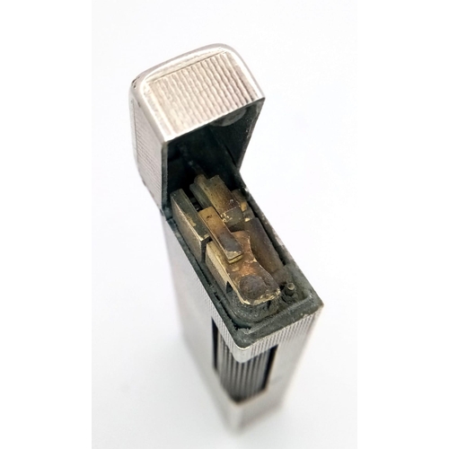 150 - A Vintage 925 Silver Dunhill Lighter. Hallmarks on base. 6.6cm x 2.5cm. Needs some gas. 88.6g total ... 