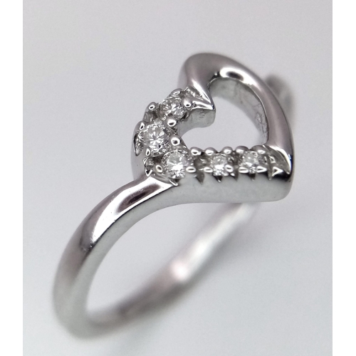 279 - A 18K WHITE GOLD DIAMOND SET OPEN HEART RING 2.7G SIZE M

ref: 7986