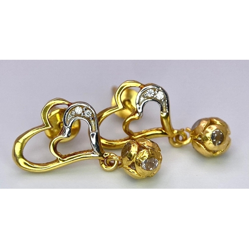 426 - A 18K yellow gold screwback fitting heart drops set Earrings with CZ, 2.5g , 2cm drop.

ref: SH1308I