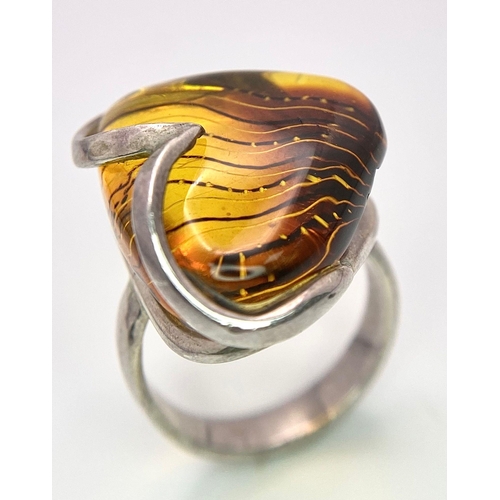 983 - A Sterling silver selection of 3 amber pieces, including 2 rings and a bracelet, 17.6g collective we... 