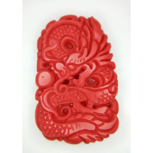 1386 - A Red Jade Decoratively Carved Dragon Pendant. 5cm.