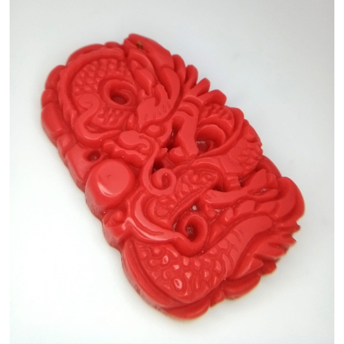 1386 - A Red Jade Decoratively Carved Dragon Pendant. 5cm.