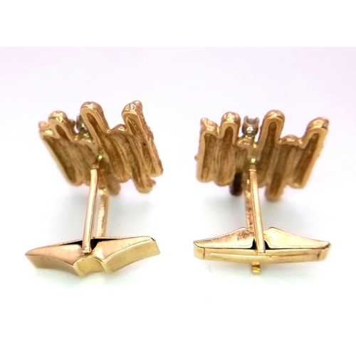 303 - A Vintage Pair of 14k Yellow Gold Bark Effect and Diamond Cufflinks - each with a brilliant round cu... 