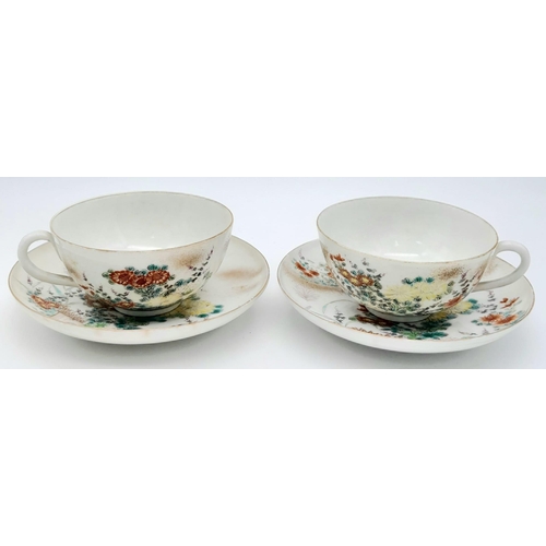 1548 - A pair of antique Japanese, hand-painted cup and saucer. 
Fine bone china with a delightful floral d... 