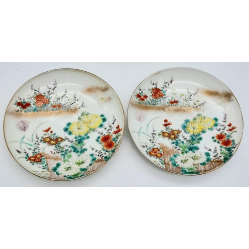 1548 - A pair of antique Japanese, hand-painted cup and saucer. 
Fine bone china with a delightful floral d... 