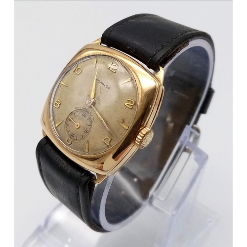 1387 - A Vintage 9K Gold Incabloc Gents Watch with a Courbelin Movement. 17 jewels. Black leather strap. 9k... 