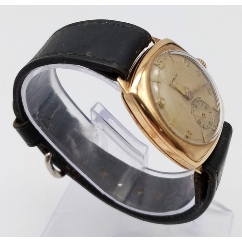 1387 - A Vintage 9K Gold Incabloc Gents Watch with a Courbelin Movement. 17 jewels. Black leather strap. 9k... 