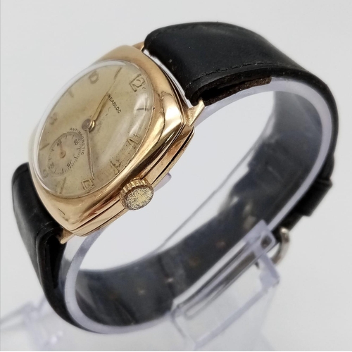 1387 - A Vintage 9K Gold Incabloc Gents Watch with a Courbelin Movement. 17 jewels. Black leather strap. 9k... 