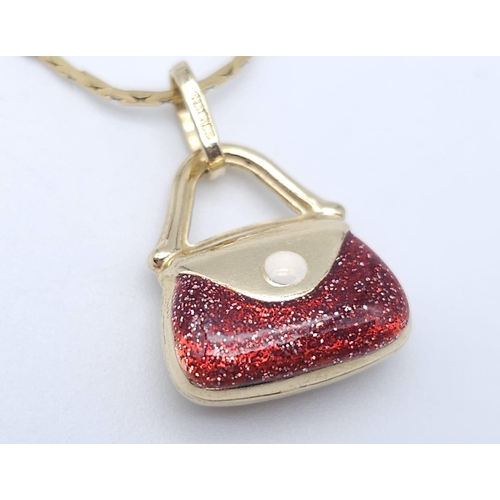 411 - An Italian 14k Yellow Gold Pendant in the Shape of a Handbag with Red Glitter Enamel Detailing on a ... 