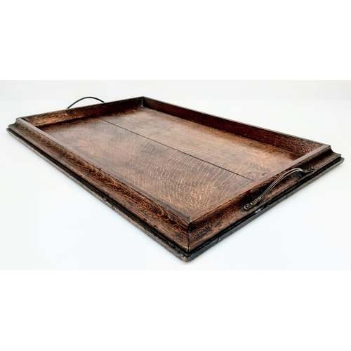 339 - A good honest piece of Victoriana. An antique, solid oak, serving tray with bronze handles. Dimensio... 