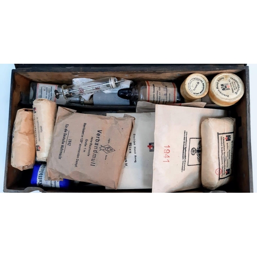 453 - A WW2 German First Aid Box with contents used by a Waffen SS Unit.