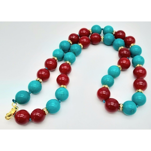 477 - A Vibrant Turquoise and Red Coral Bead Necklace. Gilded and white stone spacers. 12mm beads. 46cm ne... 