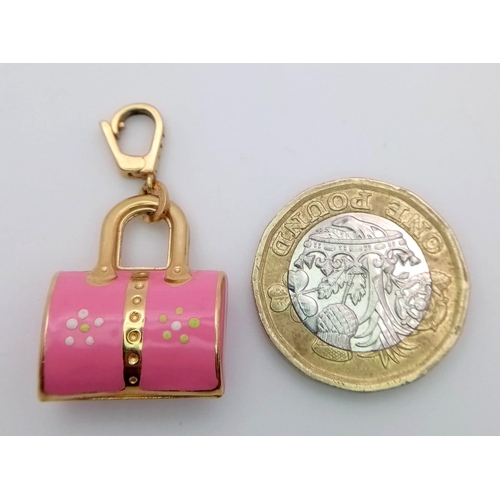 195 - A 18K YELLOW GOLD ENAMELLED LOTO HANDBAG CHARM 3.5G  32mm x 18mm

ref: SC 1090