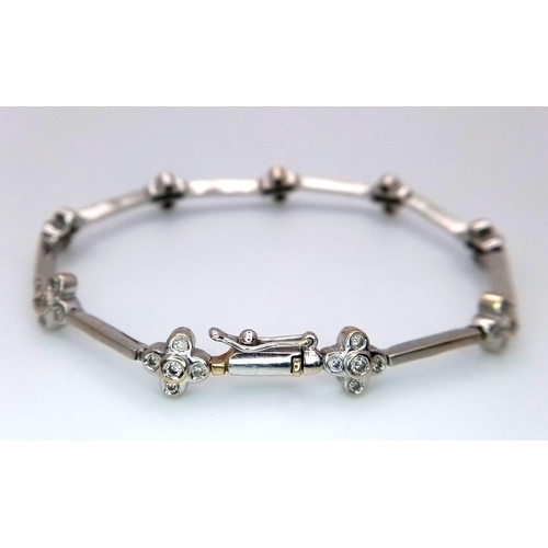 20 - A 14K WHITE GOLD DIAMOND SET IN THE FLORAL DESIGN BRACELET 0.60CT 10.3G 16.5cm length

ref: SC 1075