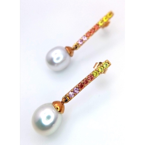 299 - A Pair of 9K Yellow Gold South Sea Pearl and Multi-Coloured Sapphire Drop Earrings. Comes with a det... 