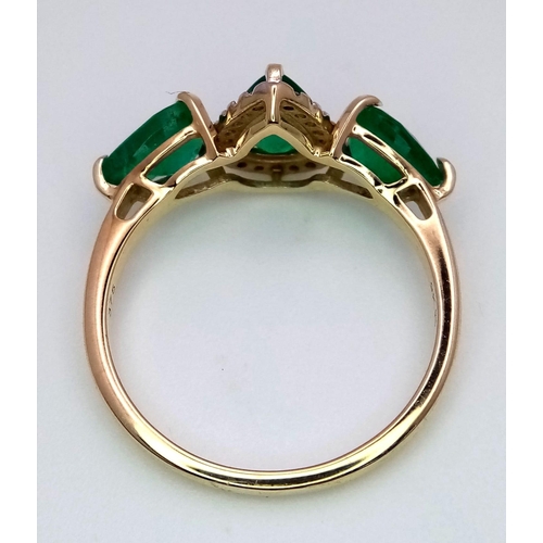 313 - A 9K Yellow Gold and Three Stone Zambian Emerald Ring with a Matching Pendant. White zircon accents.... 