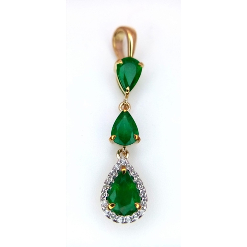 313 - A 9K Yellow Gold and Three Stone Zambian Emerald Ring with a Matching Pendant. White zircon accents.... 