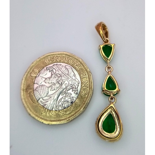 313 - A 9K Yellow Gold and Three Stone Zambian Emerald Ring with a Matching Pendant. White zircon accents.... 