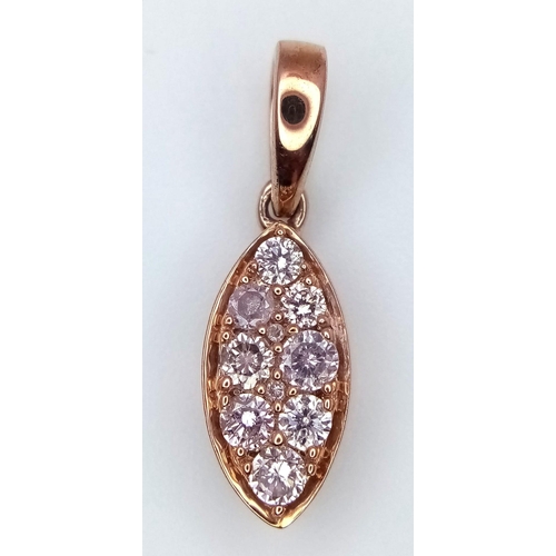 327 - A 9K Rose Gold and Seven Pink Diamond Pendant. 1.08g total weight. 2cm.