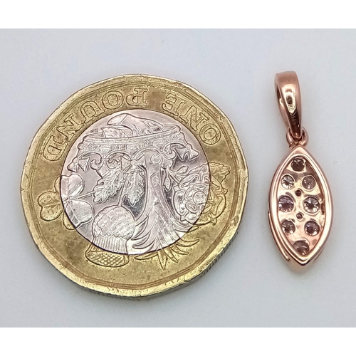 327 - A 9K Rose Gold and Seven Pink Diamond Pendant. 1.08g total weight. 2cm.