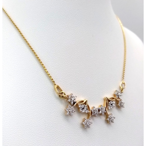 6 - An elegant 18 K yellow gold necklace with with a flower design loaded with diamonds (0.70 carats), l... 