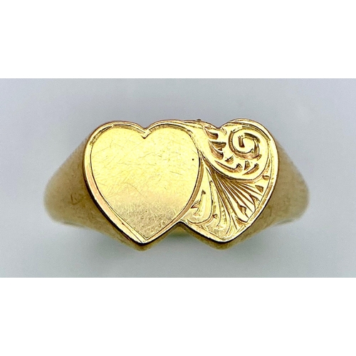 300 - A 9K YELLOW GOLD DOUBLE HEART SIGNET RING 3.9G SIZE L 1/2

ref: SC 1036