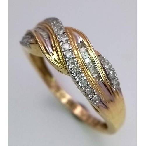 342 - A 14K YELLOW GOLD DIAMOND TWIST RING 0.20CT 3.1G SIZE S

ref: SC 1058