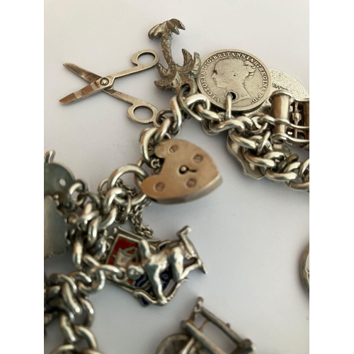 49 - Vintage SILVER CHARM BRACELET Absolutely packed with charms ,having many unusual pieces, To include ... 