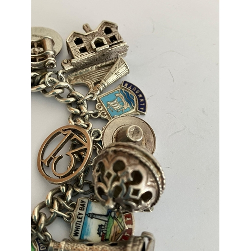 49 - Vintage SILVER CHARM BRACELET Absolutely packed with charms ,having many unusual pieces, To include ... 