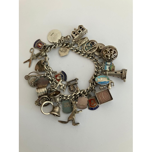 49 - Vintage SILVER CHARM BRACELET Absolutely packed with charms ,having many unusual pieces, To include ... 