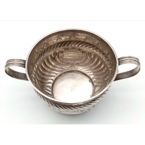 92 - An Antique Georgian Sterling Silver Two-Handled Small Bowl. Chased and Repoussé decoration throughou... 