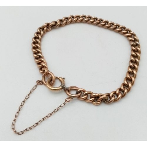 417 - A vintage, 9 K rose gold chain bracelet with security chain. Clasp in good working order. weight: 6.... 