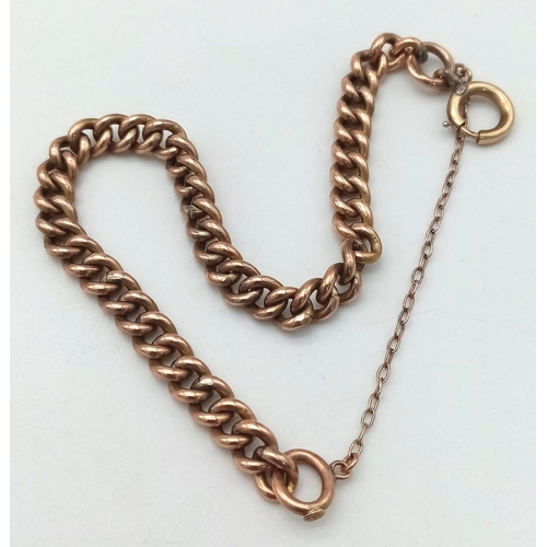 417 - A vintage, 9 K rose gold chain bracelet with security chain. Clasp in good working order. weight: 6.... 