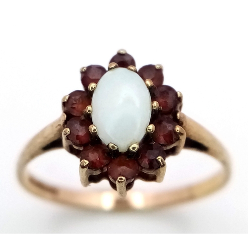 864 - A 9K YELLOW GOLD GARNET & OPAL CLUSTER RING 1.3G SIZE K 1/2

ref: SC 1035