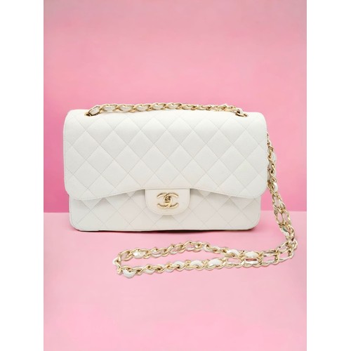 38 - Chanel Caviar Jumbo Single Flap Bag.
Quilted white caviar leather stitched in diamond pattern. Gold ... 