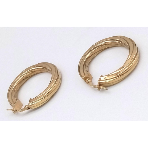 404 - A Pair of 9K Yellow Gold Ridged Hoop Earrings. 2.76g total weight.