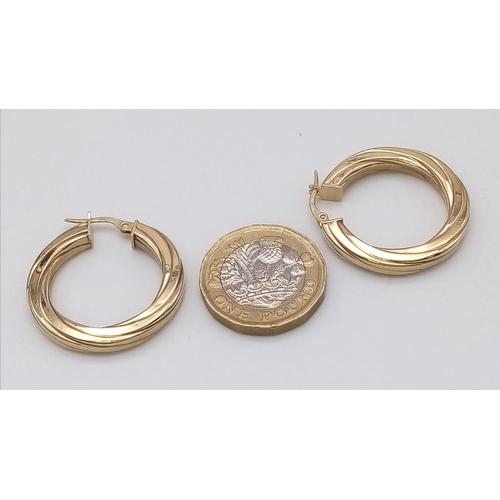 404 - A Pair of 9K Yellow Gold Ridged Hoop Earrings. 2.76g total weight.