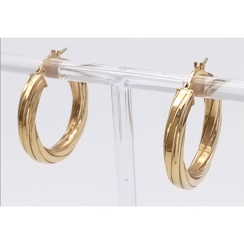 404 - A Pair of 9K Yellow Gold Ridged Hoop Earrings. 2.76g total weight.