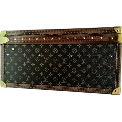 60 - A Louis Vuitton Alzer 80 Monogram Large Sturdy Suitcase/Trunk. Monogram canvas and brown leather ext... 