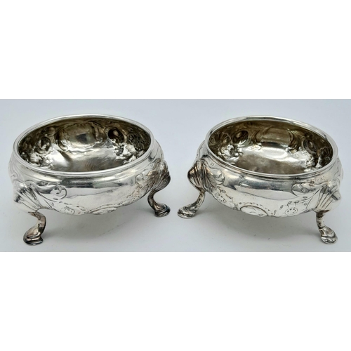 205 - A Pair of Antique Sterling Cauldron-Shaped Sterling Silver Salt Pots. Chased floral decoration throu... 